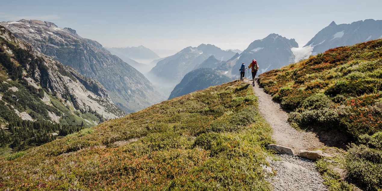 This is a group of people hiking, they are wearing waterproof backpacks This is a group of people hiking, they are wearing waterproof backpacks